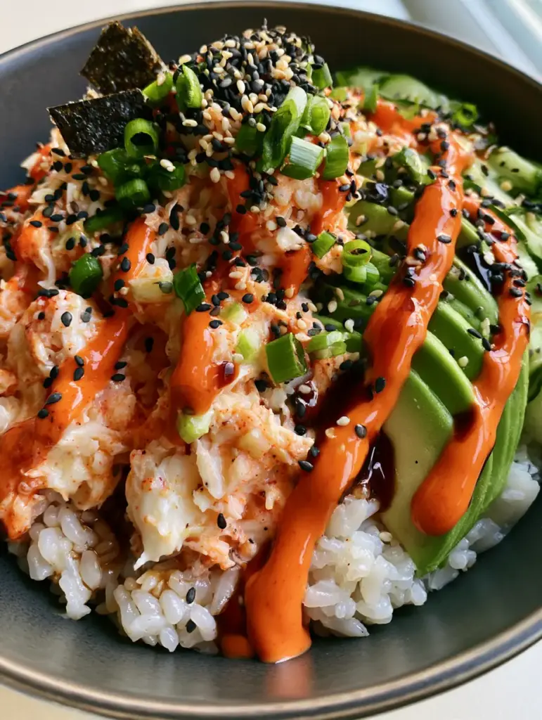 Detailed view of the sriracha mayo zig-zag and soy glaze on the Spicy Crab Sushi Bowls.